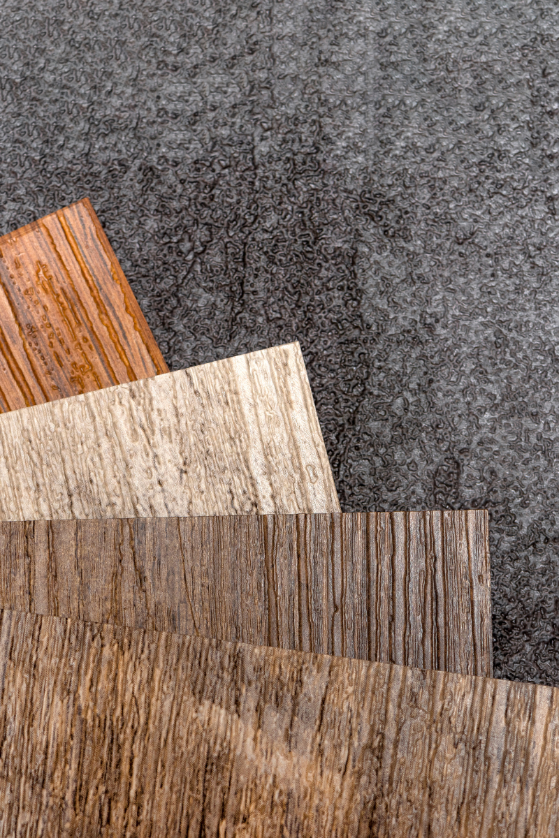 A close up of three different types of wood on a table.